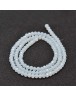 Stiklo karoliukai, apvalūs, plokšti, briaunuoti, skaidrūs, balti, matmenys: 4x3mm; skylė: 1.0mm; apie 149 vnt./gijoje