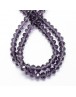 Stiklo karoliukai, apvalūs, plokšti, briaunuoti, skaidrūs, violetiniai, matmenys: 4x3mm; skylė: 1.0mm; apie 150 vnt./gijoje