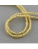 Stiklo karoliukai, apvalūs, plokšti, briaunuoti, skaidrūs, gelsvi, matmenys: 3x2mm, skylė: 0,5mm; ~200vnt./gijoje
