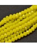 Stiklo karoliukai, apvalūs, plokšti, briaunuoti, geltoni, matmenys: 8x6mm; skylė: 1.0mm; apie 72 vnt./gijoje