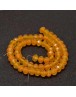 Stiklo karoliukai, apvalūs, plokšti, briaunuoti, geltonai oranžiniai, matmenys: 8x6mm; skylė: 1.0mm; apie 72 vnt./gijoje